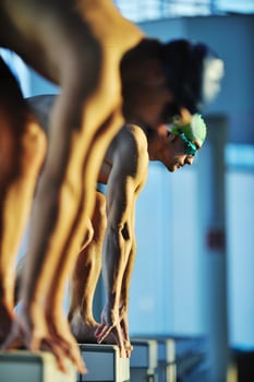 young swimmmer on swimming start photo