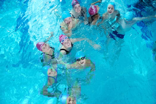 happy childrens at swimming pool photo