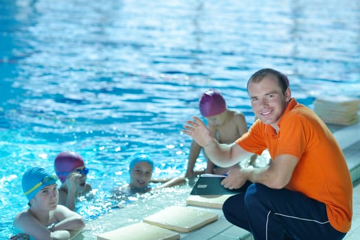 happy children group  at swimming pool photo