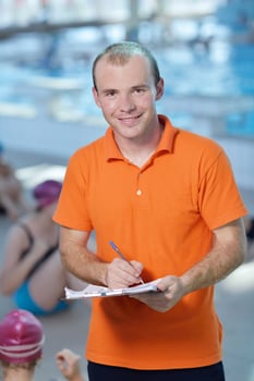 happy children group  at swimming pool photo