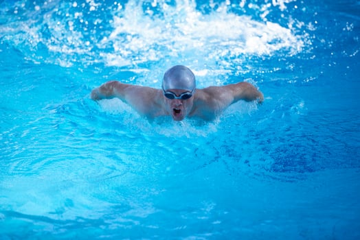 swimmer excercise on indoor swimming poo photo