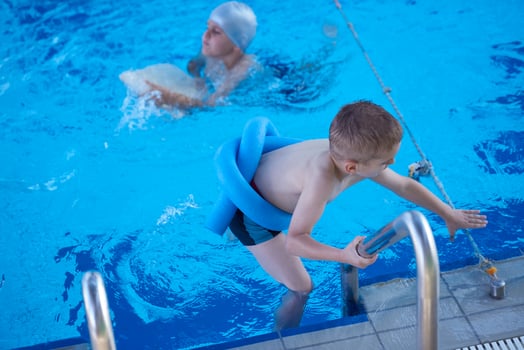 child on swimming poo photo
