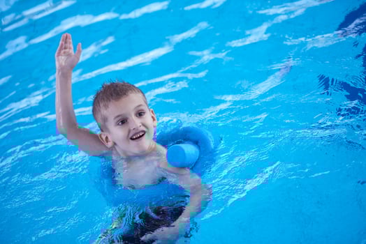 child on swimming poo photo