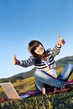 young teen girl work on laptop outdoor photo