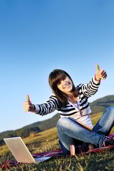young teen girl work on laptop outdoor photo
