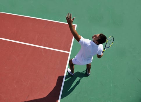 young man play tennis outdoor photo