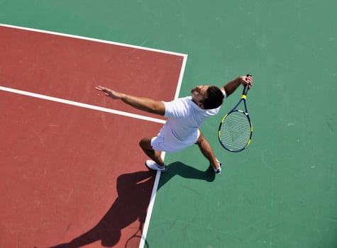 young man play tennis outdoor photo