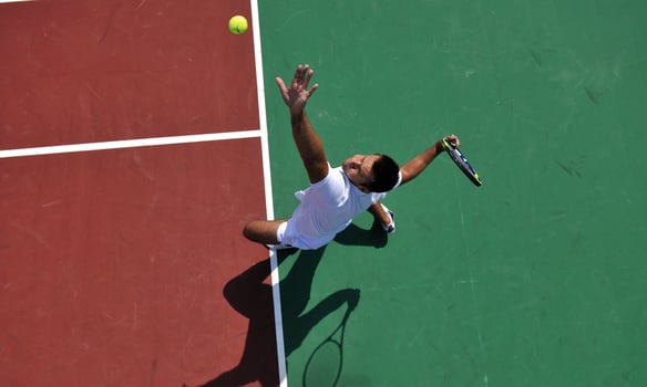young man play tennis outdoor photo