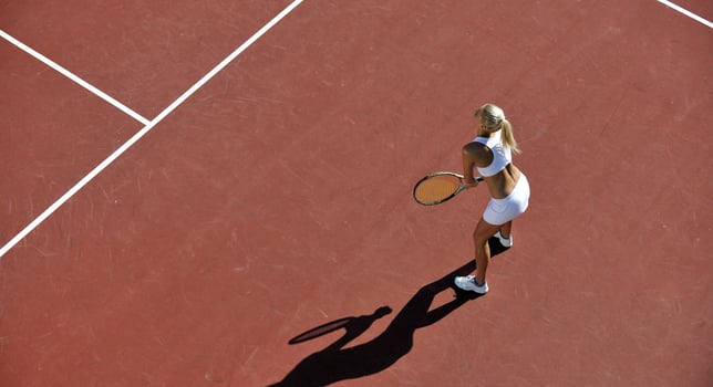 young woman play tennis outdoor photo