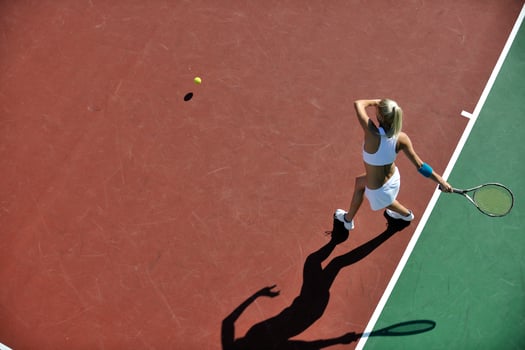 young woman play tennis outdoor photo