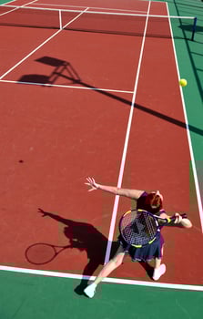 young woman play tennis game outdoor photo