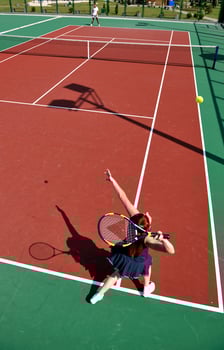 young woman play tennis game outdoor photo