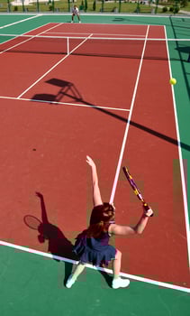 young woman play tennis game outdoor photo