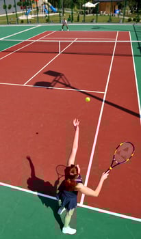 young woman play tennis game outdoor photo