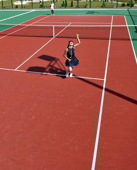 young woman play tennis game outdoor photo