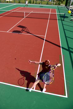 young woman play tennis game outdoor photo