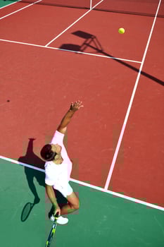 young man play tennis outdoor photo
