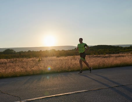 triathlon athlete running on morning trainig photo
