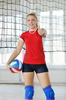 girls playing volleyball indoor game photo