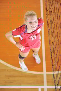 girls playing volleyball indoor game photo