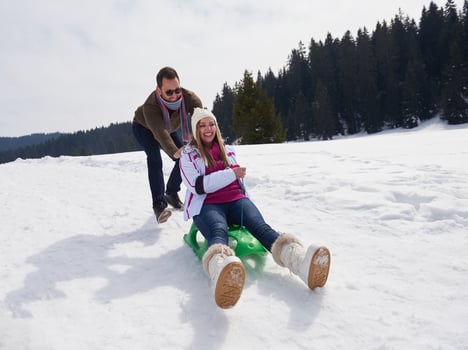 happy young couple having fun on fresh show on winter vacation photo