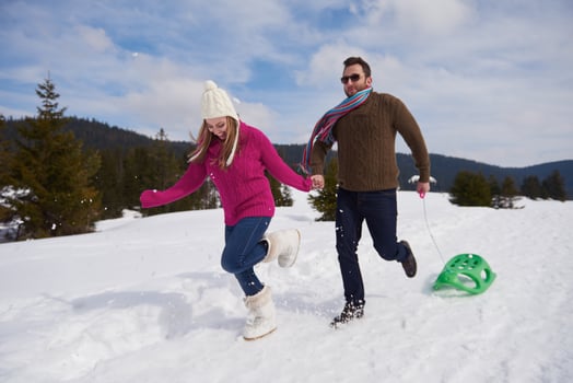 happy young couple having fun on fresh show on winter vacation photo