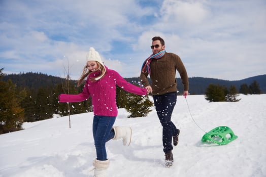happy young couple having fun on fresh show on winter vacation photo