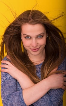 pretty woman playing with her long silky hair photo