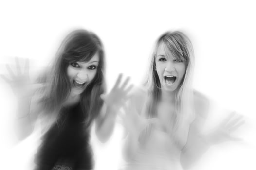 Women screaming black and white photo
