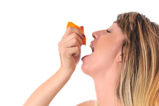 woman isolated on white hold orange photo