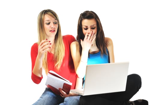 two girl work on laptop photo