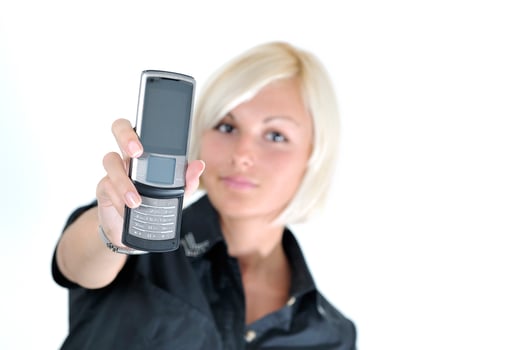 portrait of young blonde business woman holding new modern cellp photo