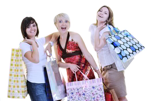 happy young adult women  shopping with colored bags photo