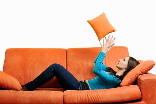 happy woman relax on orange sofa photo