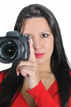 Young woman holding camera in hand taking picture isolated photo
