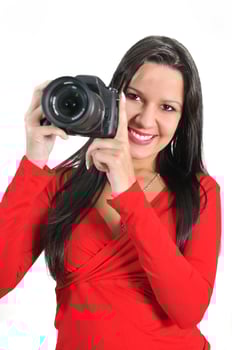 Young woman holding camera in hand taking picture isolated photo