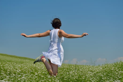 Young happy woman in green field photo