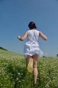 Young happy woman in green field photo