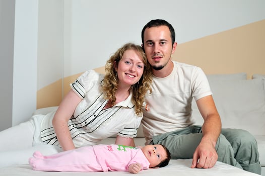 indoor portrait with happy young famil and  cute little babby photo