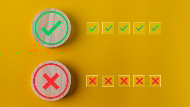 Right and wrong or voting yes or no concept. Wooden blocks with check marks on a yellow background. The idea of choice. photo