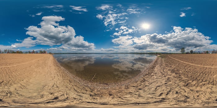 seamless spherical hdri panorama 360 degrees angle view on sand beach of huge lake or river in sunny summer day with beautiful clouds in equirectangular projection, VR content photo