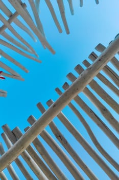 The roof of a tropical bungalow against the background of the sky, protection from the sun photo