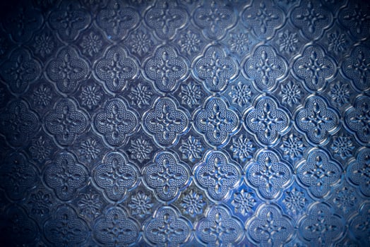 Beautiful flower pattern on blue glass-Image photo