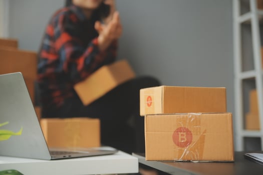 Business woman start up small business entrepreneur SME success .freelance woman working at home with Online Parcel delivery. SME and packaging deliveryconcept photo
