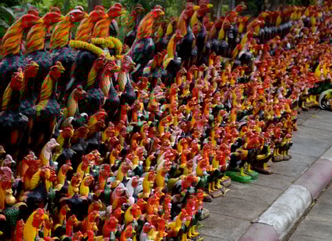 Several chicken statues in one of Thailand's sacred sites. photo