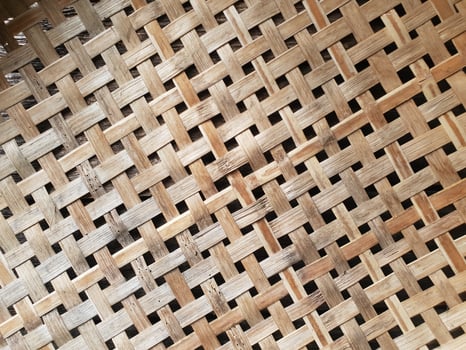 The light brown wooden basket looks beautiful as a wall decoration in the home or garden. photo