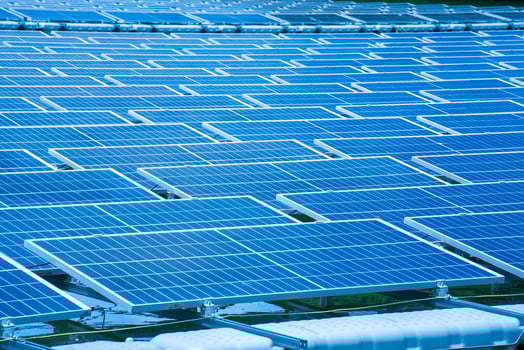 Side view of solar panels floating on water in a lake, for generating electricity from sunlight, selective focus, soft focus. photo