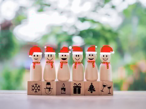 Wooden snowman with Christmas icons for Christmas decorations background photo