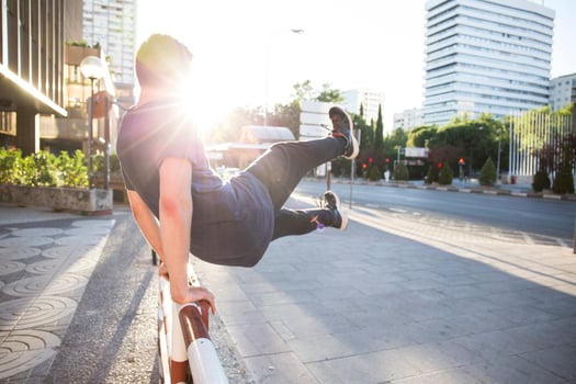 Spain, Madrid, man jumping over a fence in the city during a parkour session photo