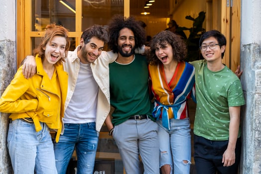 Happy group of friends posing in the city photo